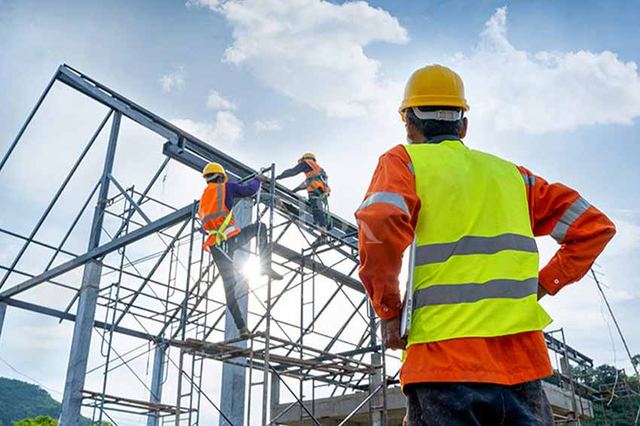 Site engineers inspecting steel structure